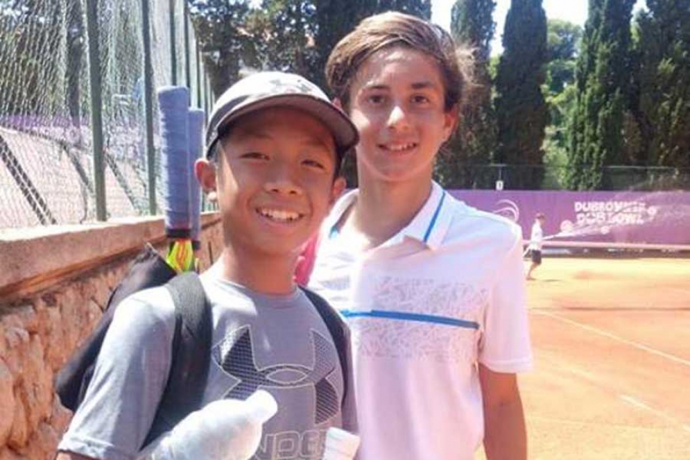 Eli junto a su compañero de dobles, el estadounidense Quang Doung.